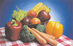 Collection of fruits and vegetables in bowl on a table