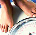 person stepping on scale