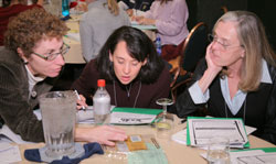 Three women participating in a hands-on lesson