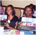 Two women holding the Heart Truth Speaker's Kit